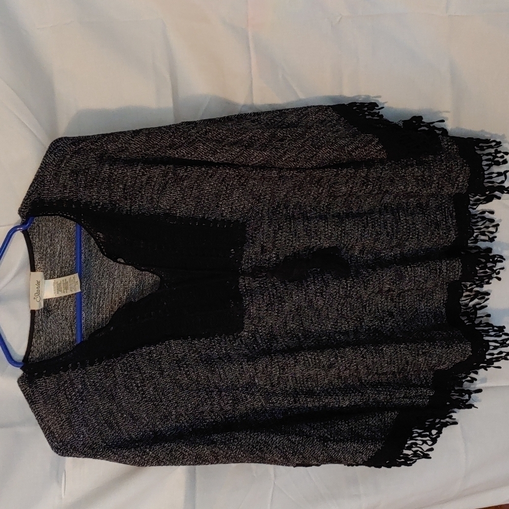 A black sweater poncho